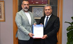 Ertuğrul Baki'den Rektör Adıgüzel'e Ziyaret